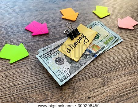 Payments Alimony. Pile Dollars With Sign Alimony And Money. Divorce And Separation Concept