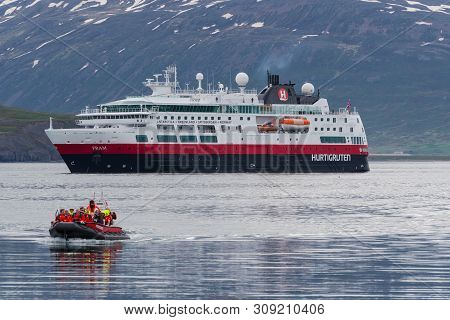 Hrisey, Iceland - June 8. 2018: Cruise Ship Fram From Norwegian Shipping Company Hurtigruten In Eyja