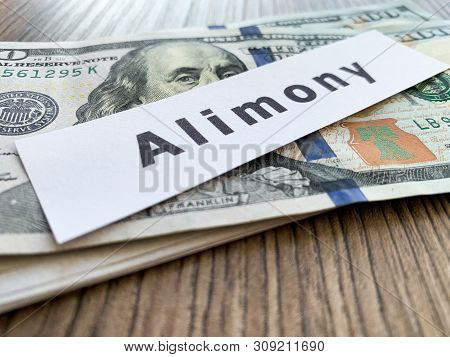 Payments Alimony. Pile Dollars With Sign Alimony And Money. Divorce And Separation Concept.