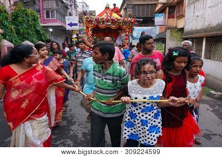 Howrah, West Bengal , India - July 22th 2018 : Young Bengali Hindu Devotees Dragging Holy Rope To Pu
