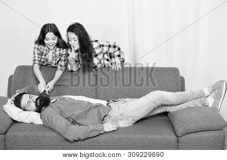 Family Prank. Little Girl With Mother Cut Fathers Beard. Happy Family At Home. Bearded Man Relax On 