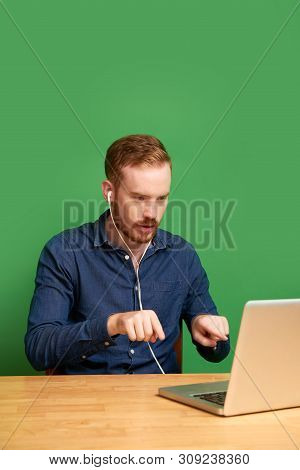 Handsome Young Irish Man Explaining Details Of Project When Video Caling His Business Parner