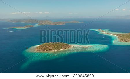 Aerial Seascape Tropical Beach With White Sand And Clear Blue Sea. Tropical Landscape With Islands A