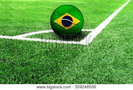 Soccer Ball On A Green Field, Flag Of Brazil