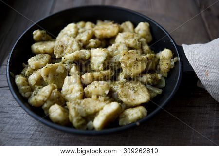 Homemade Gnocchi With Pesto Sauce And Herbs Parmesan And A Little Basil