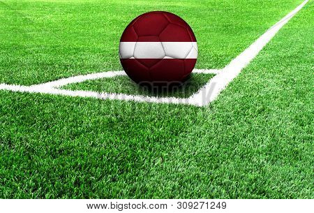 Soccer Ball On A Green Field, Flag Of Latvia