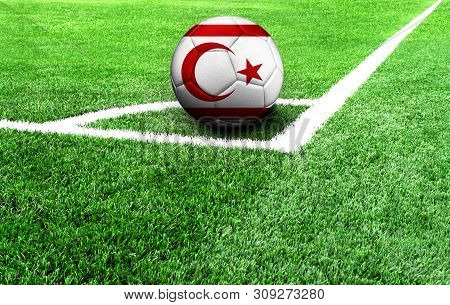 Soccer Ball On A Green Field, Flag Of Turkish Republic Of Northern Cyprus