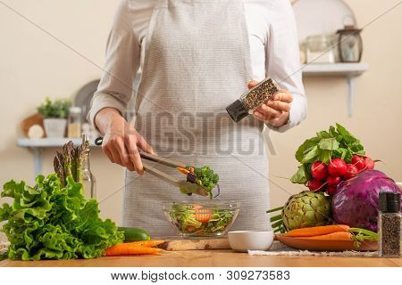 Chef Peppers Fresh And Bright Salad Close-up, On A Light Background. The Concept Of Losing Healthy A