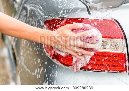 The Man Wash The Taillight Of Car/ Cleaning Taillight