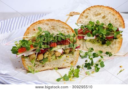 Sandwich With Green Radish Sprouts Crispy Radish And Cucumber, Tomato With Avocado Dressing And Must