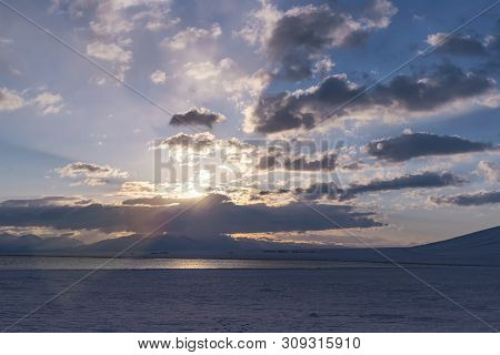Sunrise In The Mountains On The Lake Son-kul Against Cloud Sky.