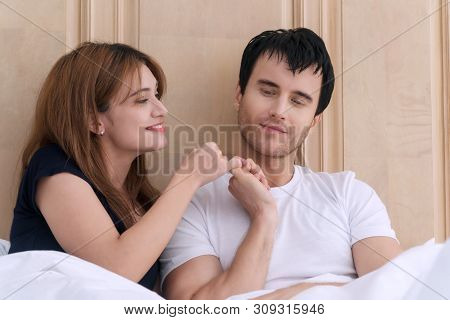 Concept Of Promise. Happy Young Couples Holding Hand Together At Home. Young Woman Trying To Reconci