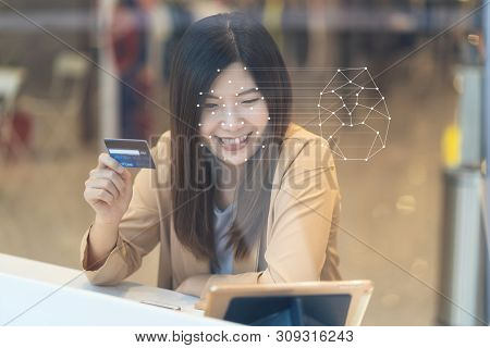 Asian Women Using The Technology Tablet For Access Control By Face Recognition In Private Identifica