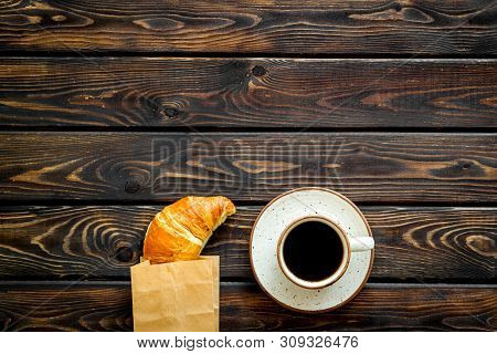 Fresh Pastry With Croissant In Paper Bag And Cup Of Coffee On Wooden Background Top View Mockup