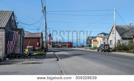 Nome, Alaska - June 10: Old Homes And Buildings With American Flags Displayed On June 10 2019 In Nom