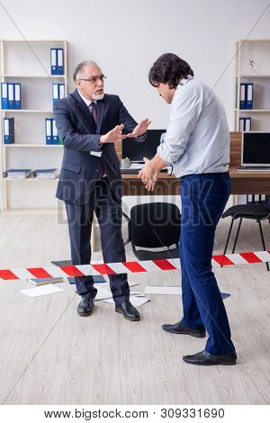 Forensic investigator investigating theft in the office
