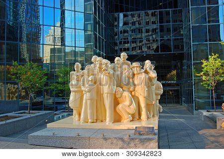 Montreal - May 3, 2009: Sculpture The Illuminated Crowd In Front Of Bnp Tower On Mcgill College Aven