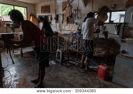 Gianyar,bali/indonesia-may 30 2019: The Guitar Craftsmen Are Working On Making Guitars In A Classica