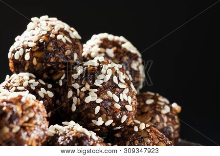 Raw Homemade Paleo Energy Balls With Rolled Oats, Nuts, Dates And Sesame, Horizontal, Close Up. Vega