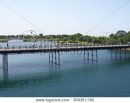 Southport, Merseyside, United Kingdom - 28 June 2019: People On The Historic Pier In Southport Merse