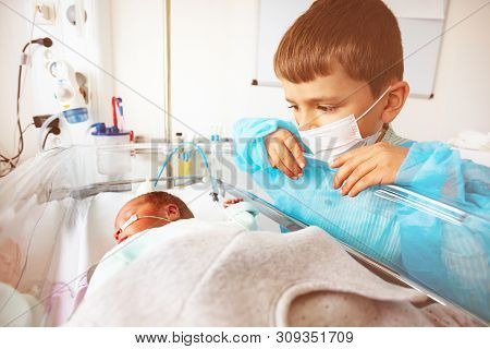 Little Boy With Premature Infant Brother, Hospital