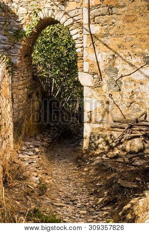 Round Doorpost In Shape Of Arch, Old Abandoned Ruins, Greece, Nature.
