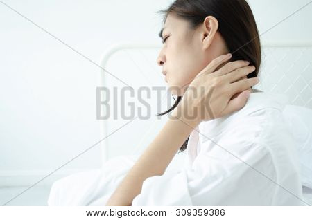 Asian women are headache severely.Lady wake up in the morning with migraine. Insomnia results in hea