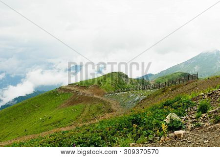 High Mountains Are Covered With Vegetation In The Summer With A Splendid View.