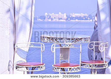 Udaipur, Rajasthan, India - 1 July 2019: Abstract Background Of Table Setting At Lake View Restauran