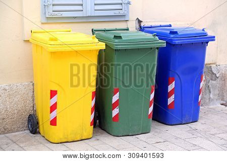 Three Recycling And Sorting Plastic Trash Wheelie Bins