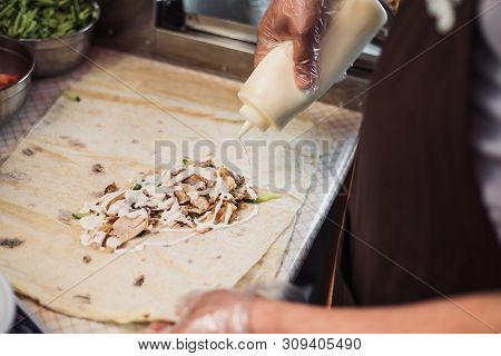 Cooking Fajitos In The Cafe. Cooking Shawarma In Pita In The Kitchen. Wrap Chicken, Carrots, Lettuce