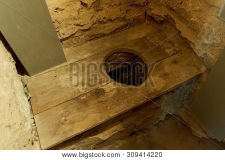 Primitive toilet in medieval castle, Serralunga d'Alba, Piedmont, Italy