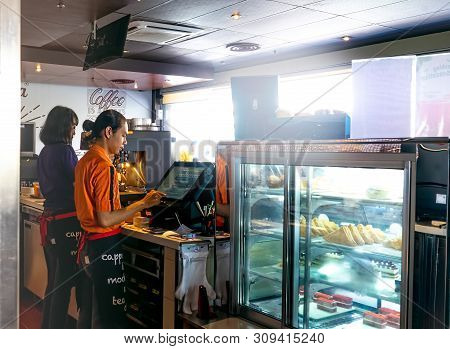 Bandung, 1 July 2019 : Barista And Cashier Preparing Customer Order In Coffee House Or Shop With Fri