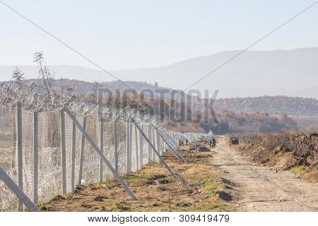 Gevgelija, Macedonia - December 23, 2015: Macedonian Soldiers Inspecting The Border Fence Wall At Th