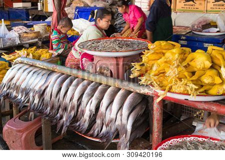 Mae Sot, Thailand - December 4th 2014: Fish, Chicken And Prawns For Sale On The Market. The Town Is 