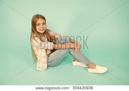 Kid Girl With Long Hair Relaxing. Just Relaxing Here. Feel Comfortable And Freely. Time To Relax. Fi