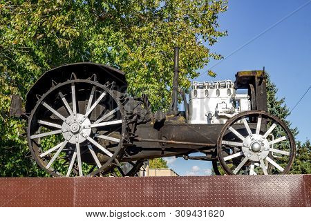 Vysokinichi, Russia - August 2018: Monument To The First Tractor Htz (kharkov Tractor Plant) In The 