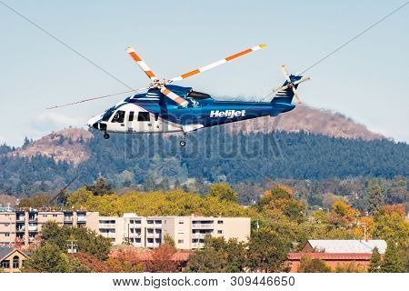 Victoria, Canada - October 02 2017: Helijet International Helicopter (cfzaa - Sikorsky S76) In Fligh