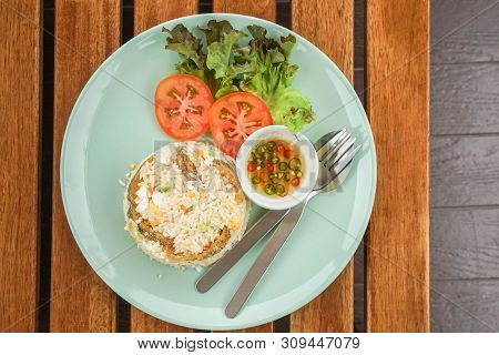 Top View Of Fried Rice With Snake Skin Gourami Dish