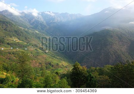 Green mountain landscape with small vollage and monastery on top of the hill, View from Nunthala in Solukhumbu region, Himalayas, Nepal