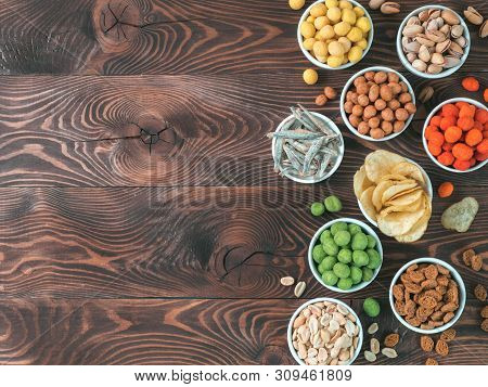 Assortment Of Different Snack For Beer, Wine, Party. Peanuts In Coconut Glaze, Green Vasabi, Red Spi