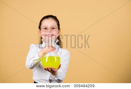 Small Smart Girl With Testing Flask. Education And Knowledge. Child Study Bilogy Lesson. Science Res