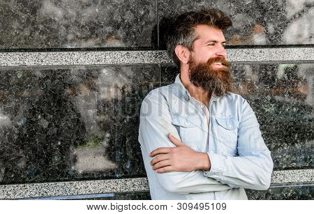 Beard Grooming. Man Attractive Bearded Hipster Posing Outdoors. Masculinity And Manliness. Confident