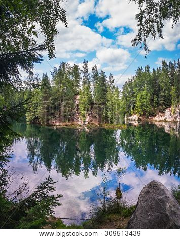Lake And Ancient Pines Growing Between Them Located In Rock City Adrspach, National Park Of Adrspach