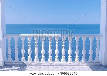 Classic White Terrace With Decorative Fence And Sea View Om Waterfront At Sunny Day.