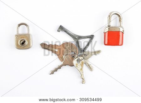 Colorful And Crisp Image Of Small Padlocks And Bunch Of Keys On White Background