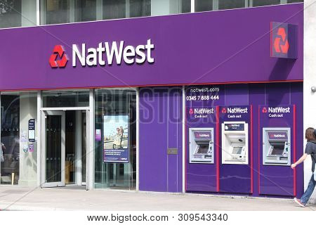 London, Uk - July 6, 2016: Person Walks By Natwest Bank Branch In London. National Westminster Bank,