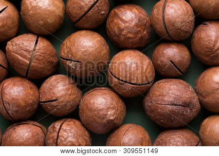 Whole Macadamia Nuts. A Lot Of Nuts Closeup. A Lot Of Macadam Nuts Closeup.