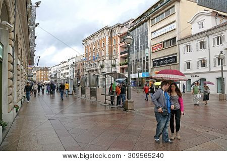 Rijeka, Croatia - October 17, 2014: People Walking At Korzo Street At Rainy Day In Rijeka, Croatia.