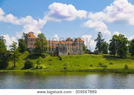 Beautiful Landscape With Ancient Svirzh ( Svirz ) Castle On The Hill Against The Blue Sky And White 